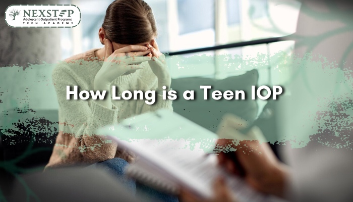 Teen with head in hands during counseling session, symbolizing the time and commitment needed for IOP.
